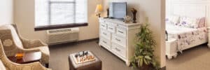 Assisted living unit with bedroom and living room at the Villages of Jackson Creek